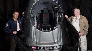 Skydiver Felix Baumgartner standing next to pod