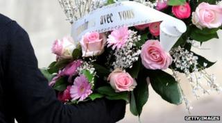 funeral flowers with sign "musulmans avec vous"