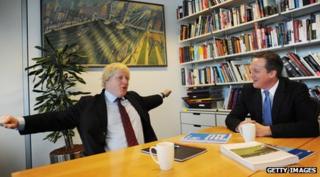 Boris Johnson and David Cameron chatting in an office
