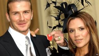 David Beckham with his OBE and wife Victoria Beckham