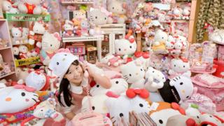Japanese girl pictured with her record breaking Hello Kitty collection.