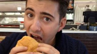 Ricky eating a burger