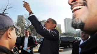 US President Barack Obama greets supporters outside a campaign office in Chicago, Illinois