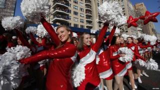 Dancers perform on Central Park West during the Macy's Thanksgiving Day Parade in New York on 22 November 2012