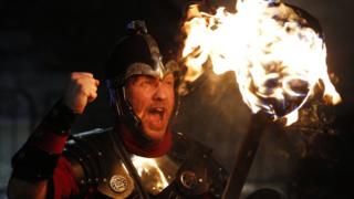 Up Helly Aa Viking Erik Burgess from the Shetland Islands, shouts while holding a lit torch during the annual torchlight procession to mark the start of Hogmanay (New Year) celebrations in Edinburgh