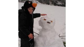 Joshua with his snowman
