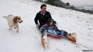 Family sledging in Dorking