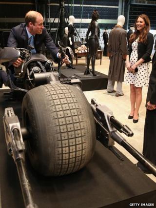 Prince William, Duke of Cambridge sits on the Batpod during the Inauguration Of Warner Bros.