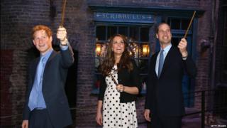 Harry, Kate and William raise their wands on Diagon Alley