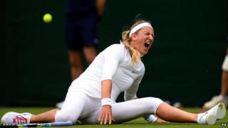 Victoria Azarenka falls during her first round match at Wimbledon