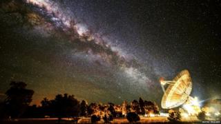 The Milky Way appears to line up with the giant 64m dish of a radio telescope at Parkes Observatory in Australia.