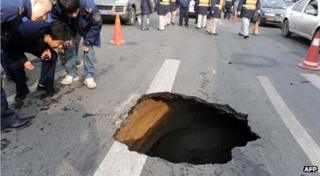 A sinkhole in a road