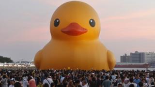 a giant Rubber Duck by Dutch conceptual artist Florentijin Hofman at Glory Pier on September 19, 2013 in Kaohsiung, Taiwan.