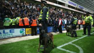 Police and police dogs at a football match