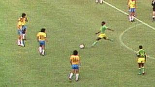 Zaire's Mwepu Ilunga kicks the ball away against Brazil