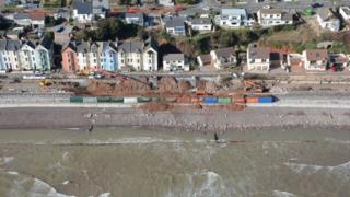 Dawlish's storm-damaged railway line reopens - BBC News