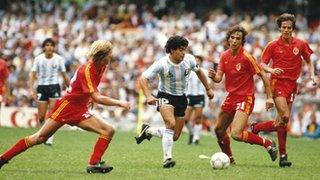 Diego Maradona scores against Belgium