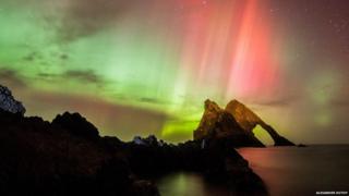The Northern Lights seen at Bow Fiddle Rock in Portknockie, Moray, Scotland