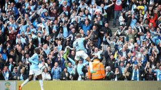 Vincent Kompany celebrates in front of fans at the Etihad stadium