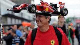 A Ferrari fan sports a novelty hat