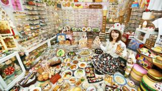 Woman displays her plastic food collection