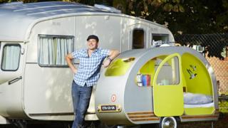 Man with tiny caravan