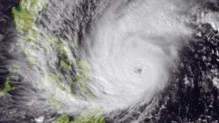 This image made available by the National Oceanic and Atmospheric Administration (NOAA) shows Typhoon Hagupit on Friday, Dec. 5, 2014