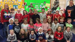 A group of school children with their Christmas jumpers