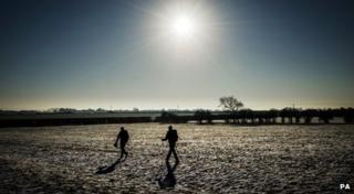 Walkers in the snow in Granby, Nottinghamshire, on Sunday