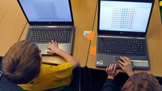 kids doing a maths test on a computer
