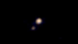 Probe spies Pluto's faint moons - BBC News