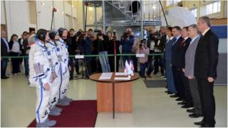 Tim Peake, nearest the camera (L), passes his Soyuz exam