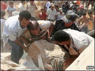 People tried to lift rocks from crushed houses (file pic)