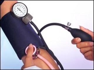 Blood pressure being checked