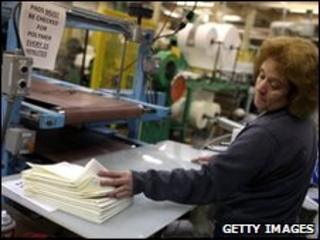 A woman working on an assembly line