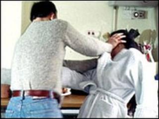 A man beating a woman
