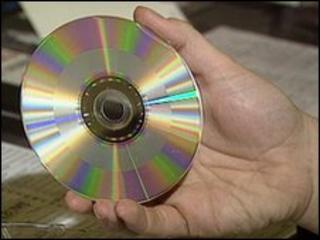 Hand holding CD