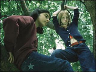 Girls climbing a tree