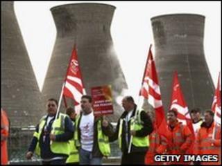 Workers at the Grangemouth oil refinery, waving flags and placards as they start their two day strike over a pension dispute on April 27, 2008