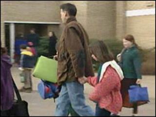 Father takes a child to school