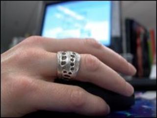 Hand on a computer mouse