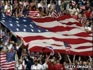 US football supporters wave flags