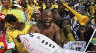 Fans at the re-opening of the showpiece Soccer City stadium in Johannesburg