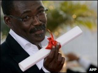 Chadian director Mahamat-Saleh Haroun poses after winning the Jury Prize for his film Un Homme Qui Crie (A Screaming Man) at the 63rd Cannes Film Festival