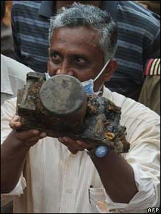 Investigator holds the Air India plane's flight data recorder
