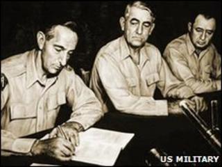 General Mark Clark signs the armistice agreement - picture from the US Military's Korean War Commemoration website