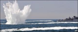A South Korean patrol boat drops a depth charge during a drill off the western coast town of Taean