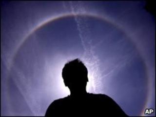 Man with Sun behind him