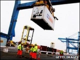 Ship freight containers being unloaded