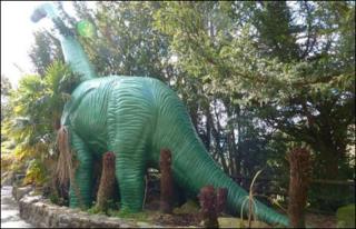 Model brontosaurus at National Showcaves Centre for Wales